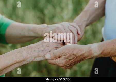 Senior couple holding hands Stock Photo