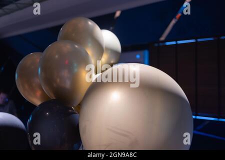Silver star shaped helium balloons on blue Stock Photo