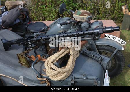 A WW2 German MG34 Machine Gun mounted on a BMW Motorcycle and Sidecar combination during a demonstration at Bovington Tank Museum, Dorset, UK Stock Photo