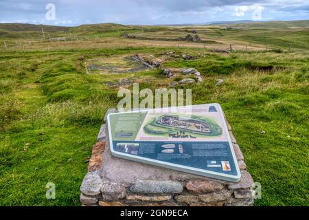 Excavated remains of the Upper House at Underhoull on Unst, a Viking longhouse dating from the 11th century. With tourist information in foreground. Stock Photo