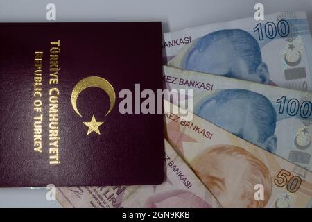 Turkish passport with money inside. Can be commented as bribe or cheap citizenship and passport from Turkey is available. Stock Photo