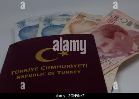 Turkish passport with money inside. Can be commented as bribe or cheap citizenship and passport from Turkey is available. Stock Photo