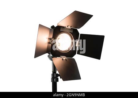 Bright studio light with barn doors isolated on white. Stock Photo