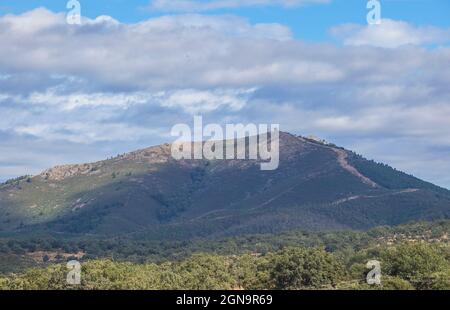 Fire lookout tower over forest of Aceituna, rural village in Alagon Valley. Caceres, Extremadura, Spain Stock Photo