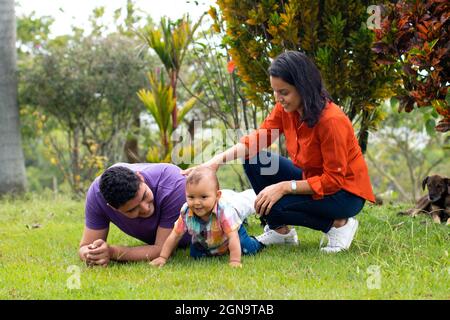 Dad and mom with their son in the field. Stock Photo