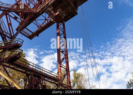 Large industrial structure against a vivid blue sky on a crisp fall morning, horizontal aspect Stock Photo