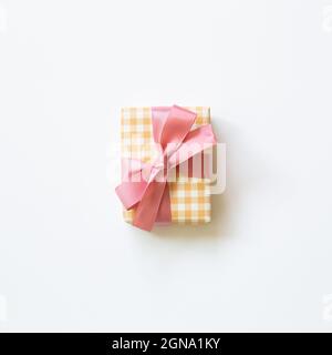 Yellow check pattern gift box isolated on white background. top view, copy space Stock Photo
