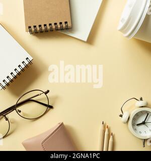 Various office supplies on beige background. workspace. flat lay, top view, copy space Stock Photo