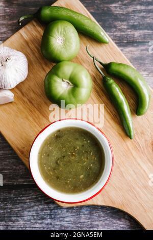 Mexican green sauce with ingredients for its preparation in mexican cuisine Stock Photo
