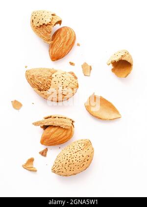 Close up group of almonds nut with shell  and cracked almonds shell isolated on white background. Stock Photo