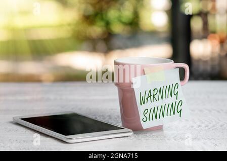 Text sign showing Warning Sinning. Word Written on stop the action which is believed to break the laws Calming And Refreshing Environment, Garden Stock Photo
