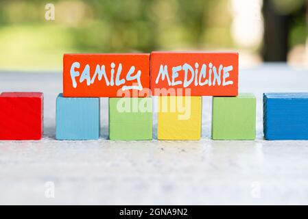 Hand writing sign Family Medicine. Word Written on designed to provide  basic healthcare to family members Working Activities Outside, Displaying  Stock Photo - Alamy