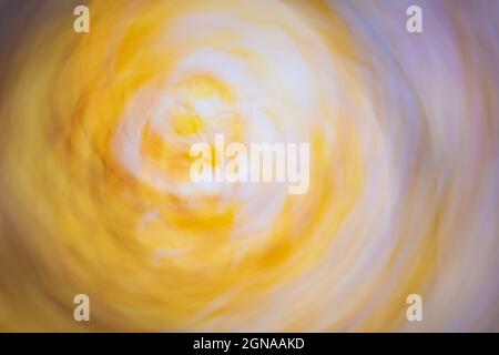 Abstract twisted background in yellow, beige, lilac, gray colors. Soft gradient. Stock Photo