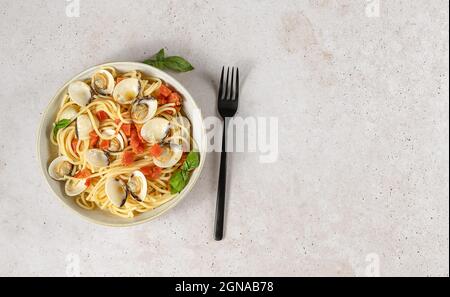 Traditional Italian seafood pasta with clams. Spaghetti alle Vongole.  Stock Photo