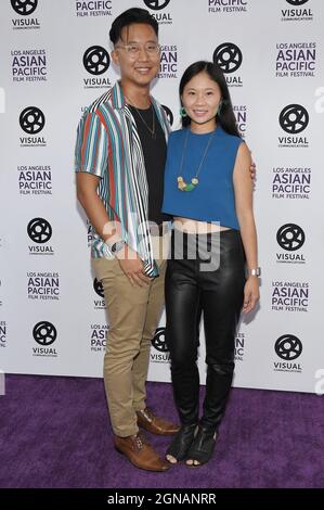 (L-R) Christian Ting And Lacy Lew Nguyen Wright Arrives At The 2021 Los ...