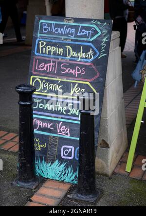 List of food available on a blackboard at the Stroud farmers Market, Gloucestershire UK Stock Photo