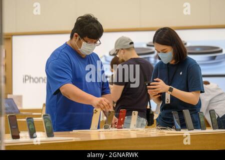 Taipei, Taiwan. 24th Sep, 2021. People are seen trying the iPhone 13 series on the launch day at the Apple store in Taipei 101. Credit: SOPA Images Limited/Alamy Live News Stock Photo