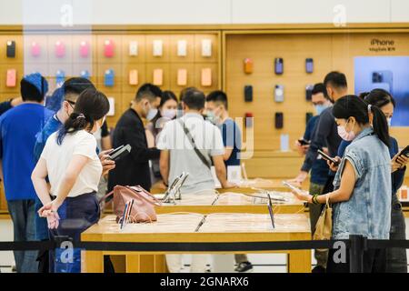 Taipei, Taiwan. 24th Sep, 2021. People are seen trying the iPhone 13 series on the launch day at the Apple store in Taipei 101. Credit: SOPA Images Limited/Alamy Live News Stock Photo