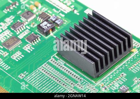 Black Aluminum heatsink on electronics or computer circuit board, Close up. Stock Photo