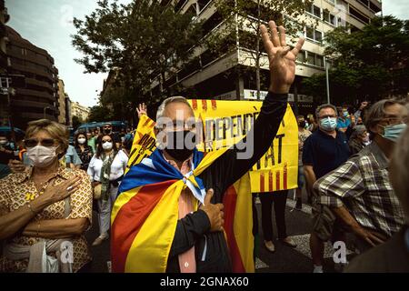 Barcelona, Spain. 24th Sep, 2021. A pro-independence activist shouts slogans close to the Italian Consulate General in Barcelona during a protest over the detention of Carles Puigdemont, former president of the Catalan Government, in Sardinia. Credit: Matthias Oesterle/Alamy Live News Stock Photo