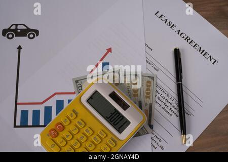 Lease agreement,  rising car prices concept. Lease agreement money and pen. Stock Photo