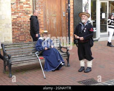 LEWES, UNITED KINGDOM - Nov 05, 2018: People in costume selling brochures and tickets in the street in Lewes town centre in preparation for the famous Stock Photo