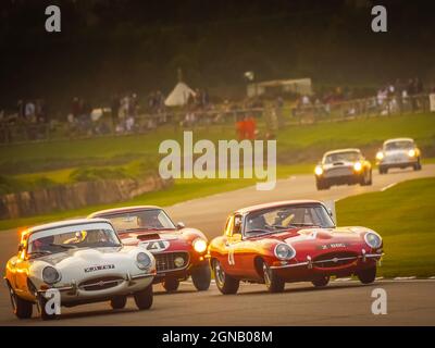Car race at sunset at the Goodwood Revival 2021, West Sussex, uk Stock Photo