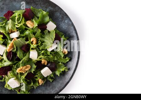 Beetroot salad with feta cheese,lettuce and walnuts isolated on white background Stock Photo