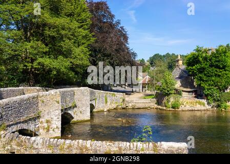 Medieval Sheepwash Bridge over the River Wye and washfold pens in the Village of Ashford in the Water, White Peak, Derbyshire  England UK GB Europe Stock Photo