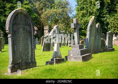 Graves in the Graveyard of the Parish Church of Holy Trinity Ashford-in-the-Water, near Bakewell Derbyshire Peak District National Park England UK, GB Stock Photo