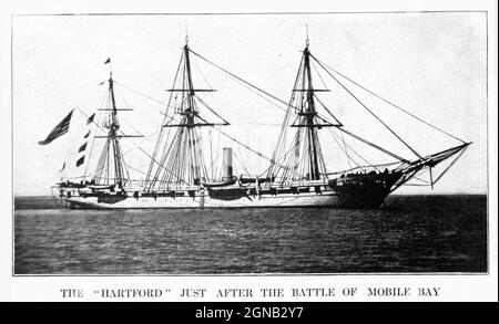 USS Hartford, a sloop-of-war, steamer, was the first ship of the United States Navy named for Hartford, the capital of Connecticut. Hartford served in several prominent campaigns in the American Civil War as the flagship of David G. Farragut, most notably the Battle of Mobile Bay in 1864. She survived until 1956, when she sank awaiting restoration at Norfolk, Virginia. from the book ' The Civil war through the camera ' hundreds of vivid photographs actually taken in Civil war times, sixteen reproductions in color of famous war paintings. The new text history by Henry W. Elson. A. complete illu Stock Photo