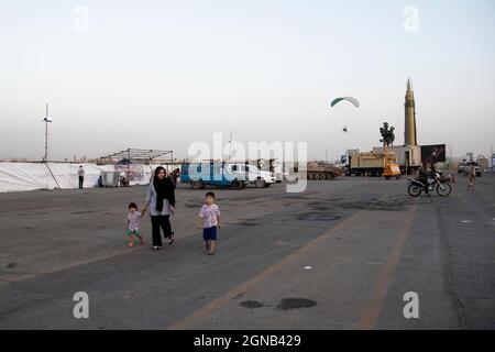 Tehran, Iran. 23rd Sep, 2021. A family visit a war exhibition which is held and organized by the Islamic Revolutionary Guard Corps (IRGC) in a park in southern Tehran to mark the anniversary of the Iran-Iraq war (1980-88) on September 23, 2021. (Photo by Sobhan Farajvan/Pacific Press) Credit: Pacific Press Media Production Corp./Alamy Live News Stock Photo