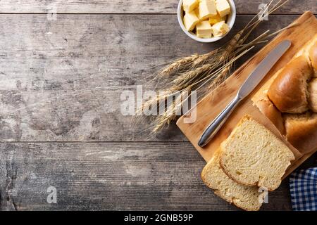 Braided egg bread on wooden table Stock Photo