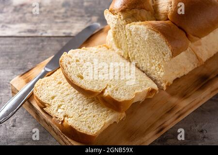 Braided egg bread on wooden table Stock Photo