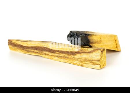 Group of two whole burnt palo santo stick isolated on white background Stock Photo