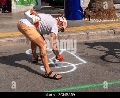 09.22.2021,Karsiyaka,Izmir,Turkey, the official who drew a bicycle picture on the street as part of the European mobility days event Stock Photo