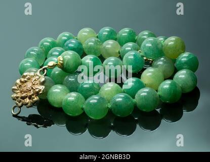 natural jade necklace with gold parts Stock Photo