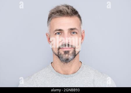 mature handsome man portrait with grizzled beard hair, male beauty Stock Photo