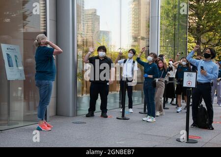 Tokyo, Japan. 24th Sep, 2021. Customers are welcomed by employees during the launch day at Apple Marunouchi store in Tokyo, Japan on Friday, September 13, 2021. Credit: UPI/Alamy Live News Stock Photo