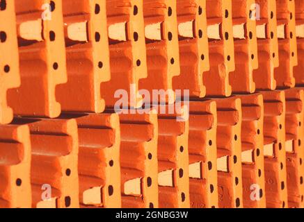 Stack of orange ceramic roof tiles. Stock Photo