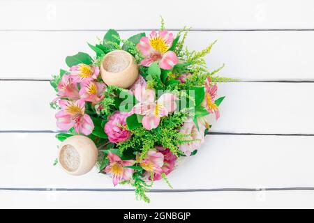 Top view of fresh flowers composition on white wooden background with copy space Stock Photo
