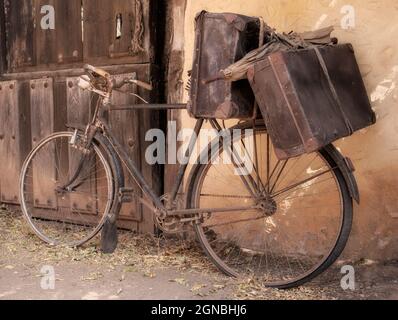 old and broken bicycle, abandoned on a facade Stock Photo