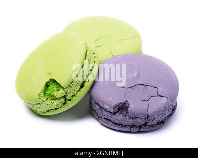 Group of broken macaroons isolated over white background Stock Photo