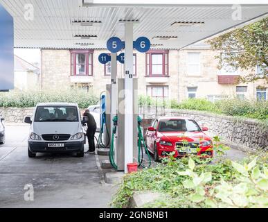 Camborne, Cornwall, 24th September 2021, People panic buying Fuel queue in their cars outside Tesco, Camborne in Cornwall, there is fuel still available. In other parts of the country panic buying has encouraged some petrol stations to increase their prices.The Government has been trying to reassure people not to panic buy. Credit: Keith Larby/Alamy Live News Stock Photo