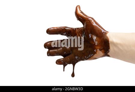 An open male hand dripping and spilling molten chocolate, white background Stock Photo