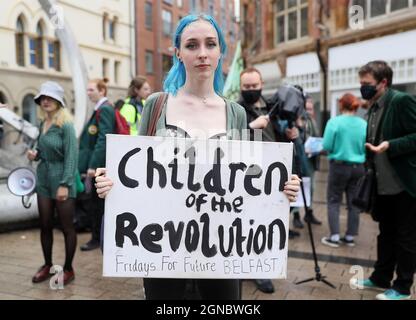 Kay Laverty (19) of Fridays For Future Northern Ireland, attends a global youth climate strike in Belfast city centre, one of more than 1,000 events taking place around the world just over a month before the UN Cop26 climate talks in Glasgow. Picture date: Friday September 24, 2021. Stock Photo