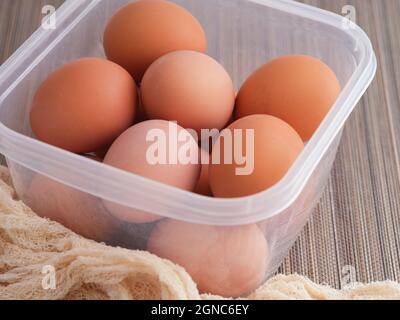 Hard boiled eggs in a plastic container. Close up. Stock Photo