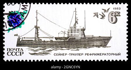 USSR - CIRCA 1983: Stamp printed on USSR shows a seiner - trawler a refrigerator Stock Photo