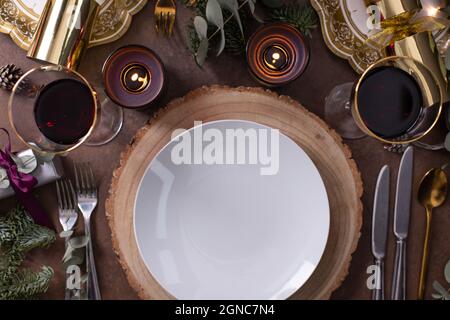 Christmas, a table setting, overhead view, wine and candles, plates and cutlery Stock Photo