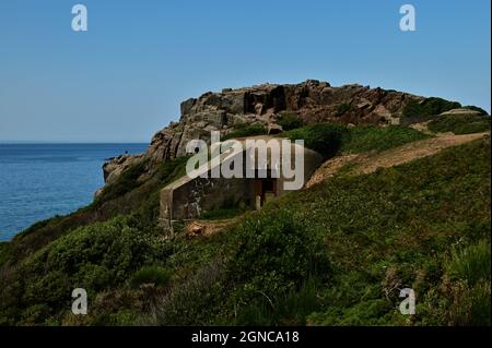 An external view of a German World War Two military bunker at Petit Port on the scenic coast of Jersey in the Channel Islands. Stock Photo